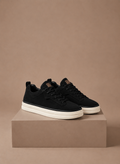 Nette sneakers heren, draagbeeld met pantalon – Estrani